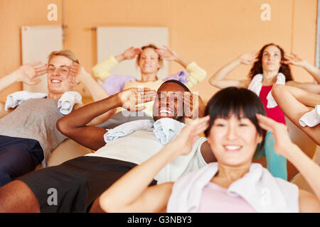 Interracial group working out at fintess studio Stock Photo
