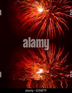 sparks fireworks water reflection Stock Photo