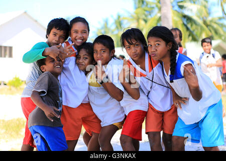 Local children posing near school, Christmas Island, Kiribati Stock Photo