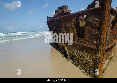 Impressive SS Maheno luxury shipwreck resting on the beach on clear blue sky day Stock Photo