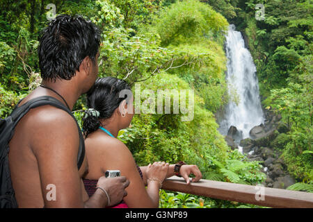 Indian couple looking at Trafalgar Falls, Roseau Valley, Dominica, Caribbean, West French Indies, Central America Stock Photo