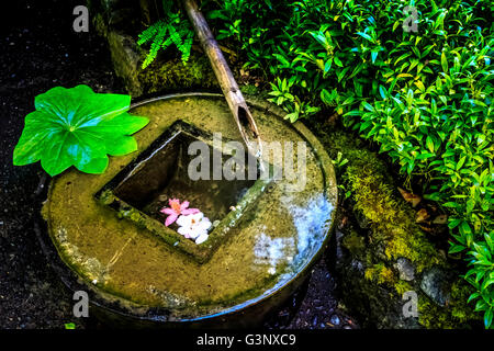 Stone water basin for ritual purification Stock Photo