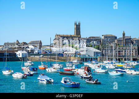 Boast in the harbour at high tide in Penzance, Cornwall, England, UK Stock Photo