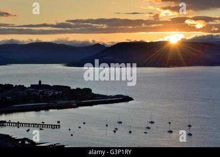 The sun setting over the west of Scotland, Gourock and the river Clyde Stock Photo