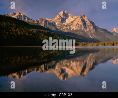 USA, Idaho, Sawtooth National Recreation Area, Morning storm clouds over McGown Peak which is reflected in Stanley Lake. Stock Photo