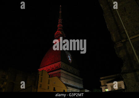 On 4 may, the 67 anniversary of the Superga air disaster, where players of the 'Grande Torino' lost their lives in a plane crash, the symbol of Turin, the Mole Antonelliana is lighted with red-Garnet and the main façade is projected the team's symbol (Photo by: Daniela Parra Saiani/Pacific Press) Stock Photo