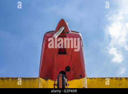 Vintage airplane seen from below, with blue sky in the background Stock Photo