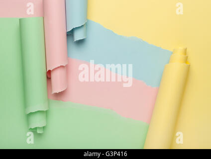 Torn colorful paper forming abstract background Stock Photo