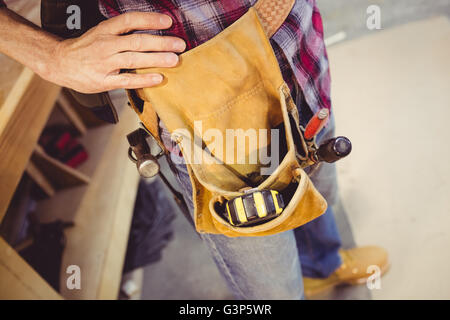 Carpenter with tools pannier Stock Photo