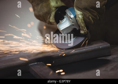 Worker using an angle grinder Stock Photo