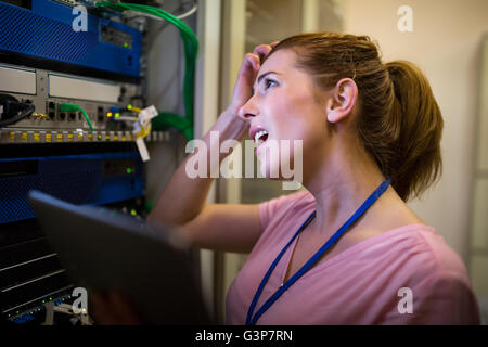 Technician working on broken server Stock Photo