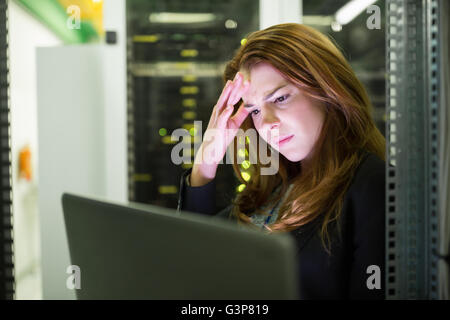 Technician using laptop Stock Photo