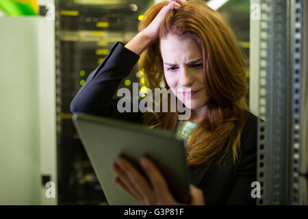 Technician using digital tablet Stock Photo