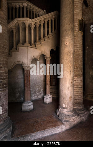 Marble and red brick staircase and pillars in the Basilica di santo Stefano, Bologna, Italy. Stock Photo