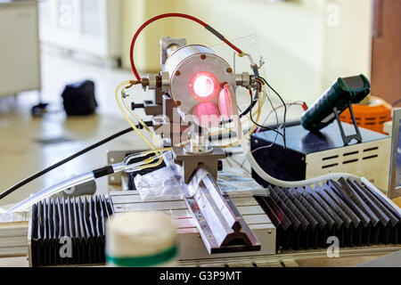 Red laser on optical table in physics laboratory Stock Photo - Alamy