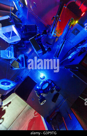 Blue laser on optical table in a quantum optics lab. Stock Photo