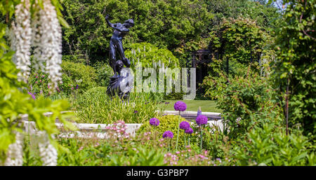 LONDON, UK - JUNE 6TH 2016: Hylas and the Nymph statue located in the beautiful St. Johns Lodge Gardens in Regents Park, London Stock Photo