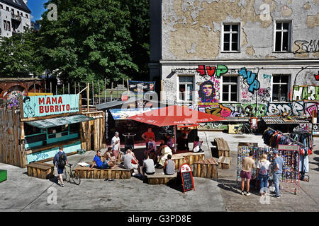 Graffiti in bohemian Friedrichshain - Kreuzberg  Berlin RAW temple, former railway yards, Warschauer Strasse - Revaler Straße Germany  ( nightlife spot night club area ) Stock Photo