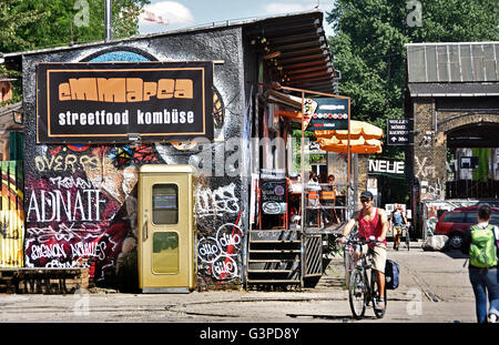 Graffiti in bohemian Friedrichshain - Kreuzberg  Berlin RAW temple, former railway yards, Warschauer Strasse - Revaler Straße Germany  ( nightlife spot night club area ) Stock Photo