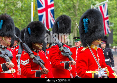 Soldiers from the Irish Guards march along The Mall at Trooping The Colour also known as The Queens Birthday Parade, The Mall ,London, UK Stock Photo