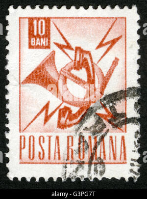 ROMANIA - : A stamp printed in the Romania, the emblem of the Post and Telecommunication, Stock Photo