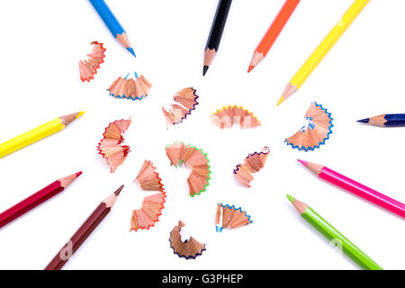Multicoloured pencils and shavings on a white background Stock Photo