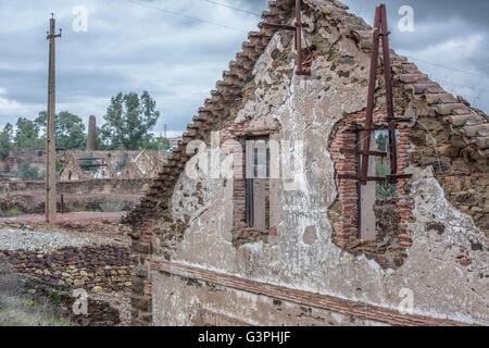 Damaged buildings in São Domingos Mine, a deserted open-pit mine in Mertola, Alentejo, Portugal. Stock Photo