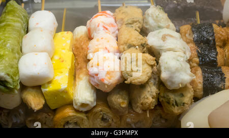 The close up of Taiwanese oden meat balls on stick at food street night market in Taipei, Taiwan. Stock Photo