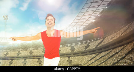 Excited male athlete with arms outstretched Stock Photo