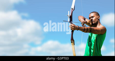 Composite image of facing view of man practicing archery against white background Stock Photo