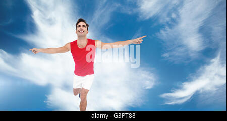 Excited male athlete with arms outstretched Stock Photo