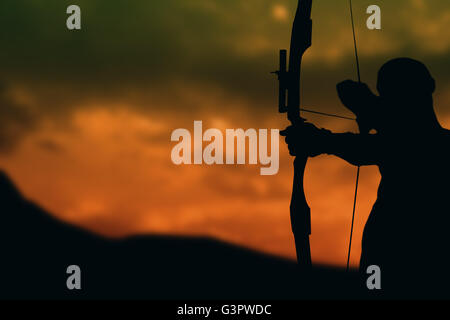Front view of sportsman is practicing archery Stock Photo