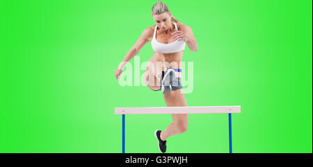 Female athlete jumping Stock Photo