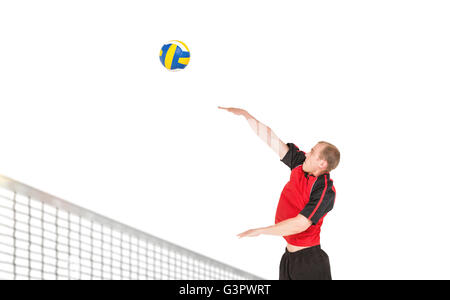 Sportsman hitting volleyball Stock Photo