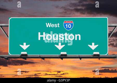 Houston Interstate 10 west highway sign with sunrise sky. Stock Photo