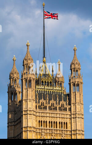 The Union Flag flying from the top of the Victoria Tower at the Houses of Parliament in London. Stock Photo