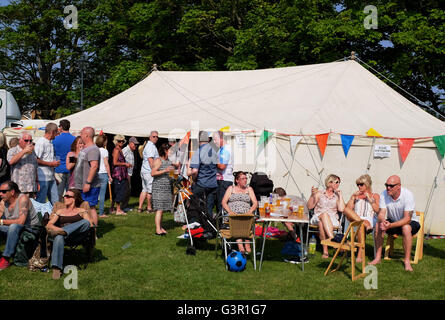 People at a traditional English summer party on the green or fete in East Preston West Sussex village UK Stock Photo