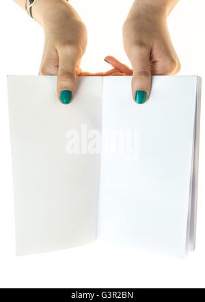 hands with green nails polish holding a book with blank pages, isolated on white background Stock Photo