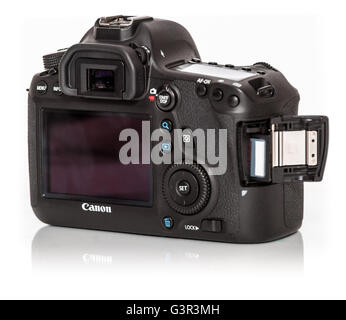Stock Photo - CANON EOS 5DSR DSLR 50 megapixels, full frame digital photo camera, on a white background from back with card door Stock Photo