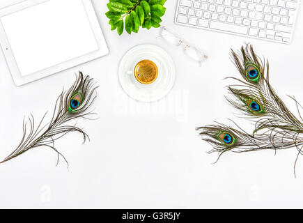 Office desk with keyboard, tablet pc, coffee, green plant.  Flat lay. Mock up Stock Photo