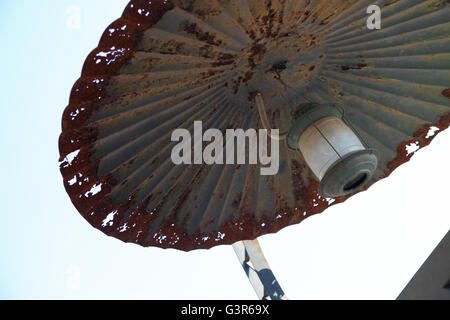 Vintage, sheet metal, corrugated, cover shade, factory lamp, lights, weathered, green enamel, pendant factory lamp, security, rusty, industrial, rain. Stock Photo