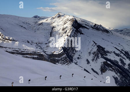 Ski slope with snow cannon at evening. Greater Caucasus, Mount Shahdagh. Qusar rayon of Azerbaijan. Stock Photo