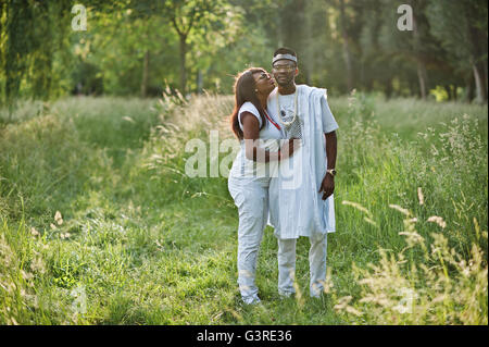 Black african couple in love kissing at green park on sunset Stock Photo