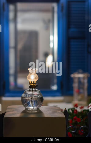 Oil lamp at the yard of a house, in Meganisi island, Greece Stock Photo
