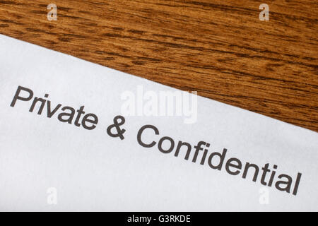 Private and Confidential printed on a piece of paper. Stock Photo