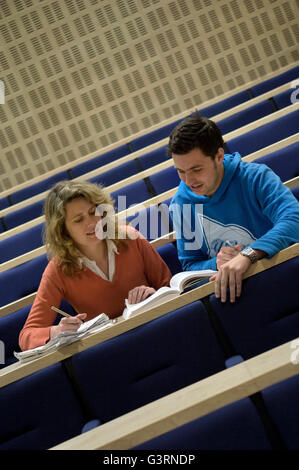 Two students studying in the lecture theatre. England. UK Stock Photo