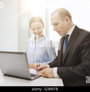 business team with laptop having discussion Stock Photo