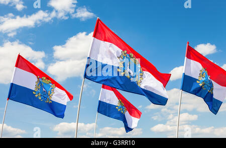 Flags of Federal Subjects of Russia. Flags of Samara region fluttering against the blue sky Stock Photo