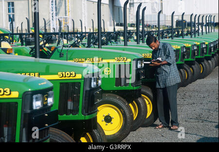 INDIA, Pune, American multinational John Deere tractor factory, production of John Deere tractor 5103 for the indian market and for export to africa and asia, storage place Stock Photo