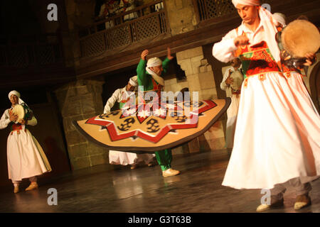 Cairo, Egypt. 13th June, 2016. Egyptian dancers perform the Tanoura, an Egyptian version of Sufi Dance, at a night show during the holy fasting month of Ramadan, at Al Ghouri Palace in Cairo, Egypt, June 13, 2016. © Ahmed Gomaa/Xinhua/Alamy Live News Stock Photo